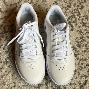 Women’s Puma sneakers with silver Puma on the side. Brand new with box!!!